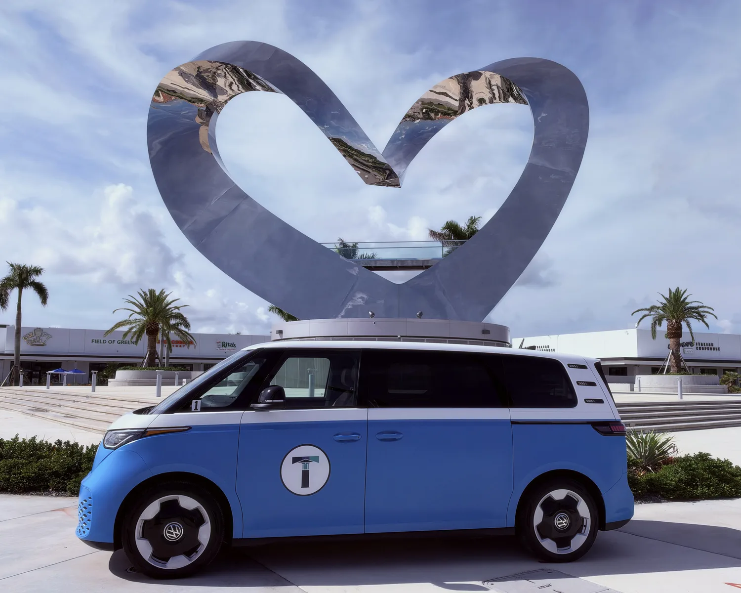TIM Shuttle in front of the Heart in the Park sculpture in Tradition