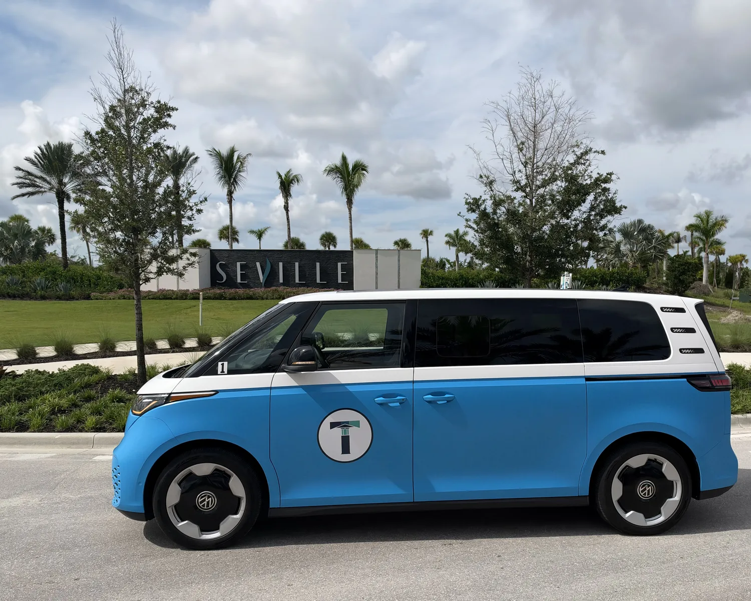 TIM Shuttle electric Volkswagen ID. Buzz in front of the Seville neighborhood sign in Tradition, Port St. Lucie